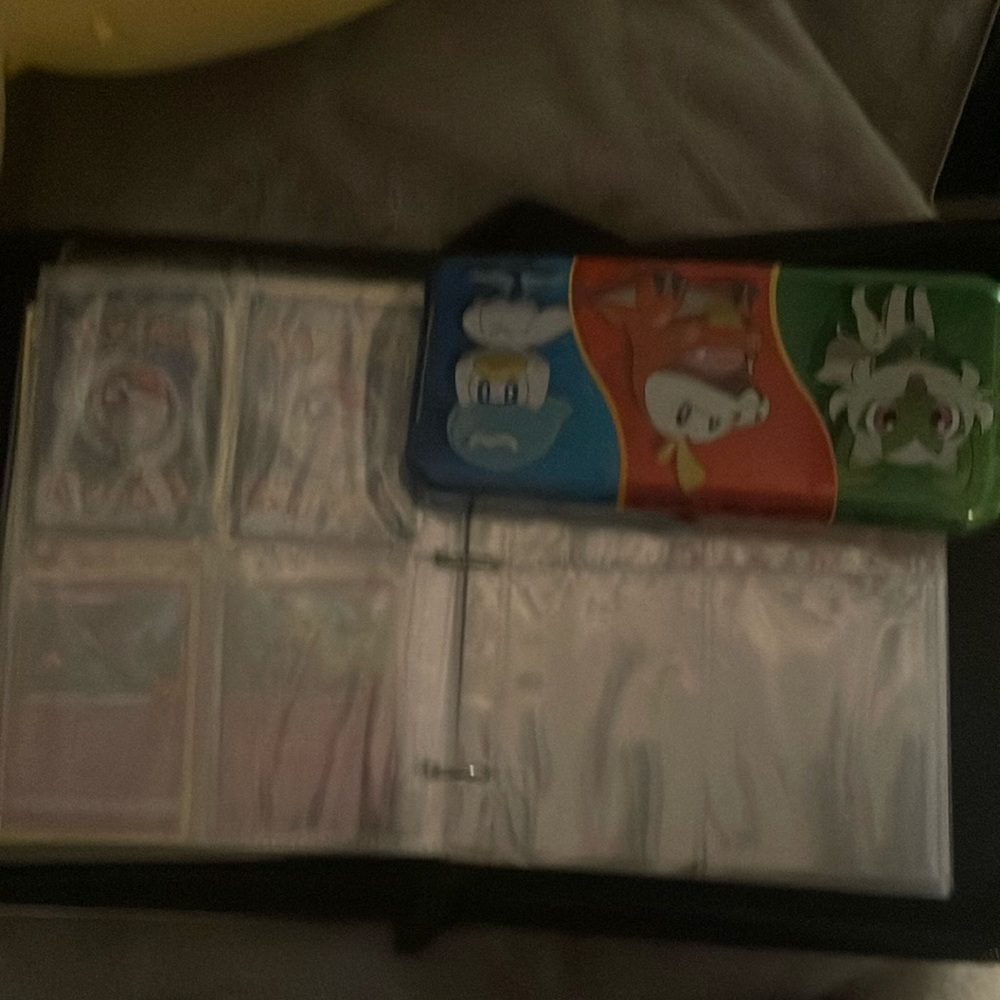 Pokémon cards and binder plus metal thing